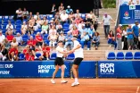 Nino Toto high-fives his doubles partner